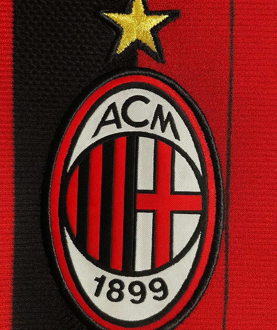 AC Milan 2013/14 home shirt — club crest close-up