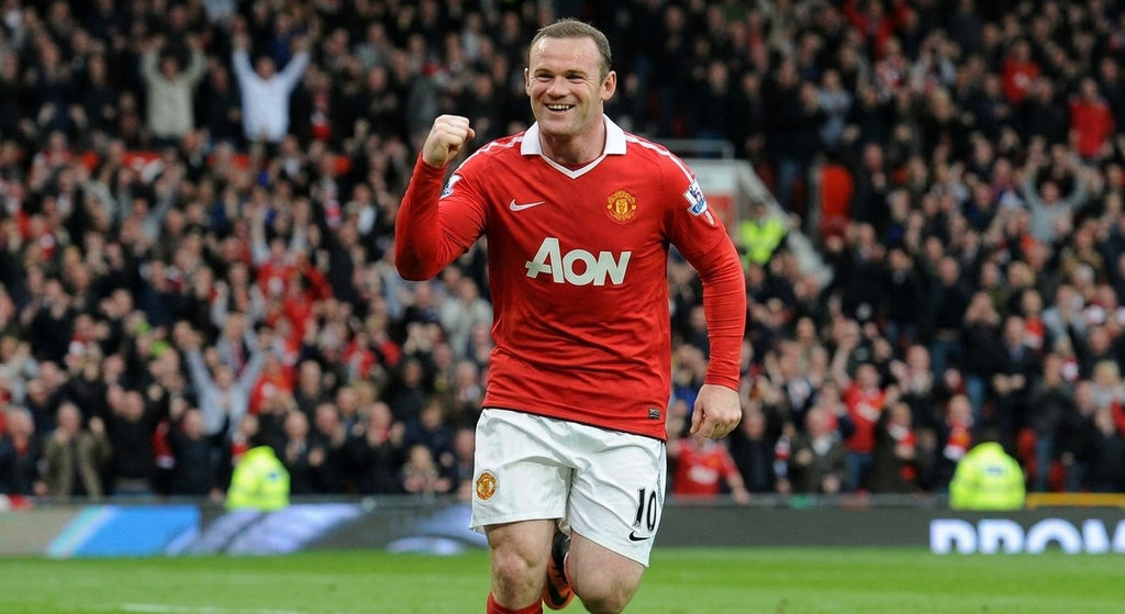 Rooney celebrating in the Manchester United 2010/11 home shirt