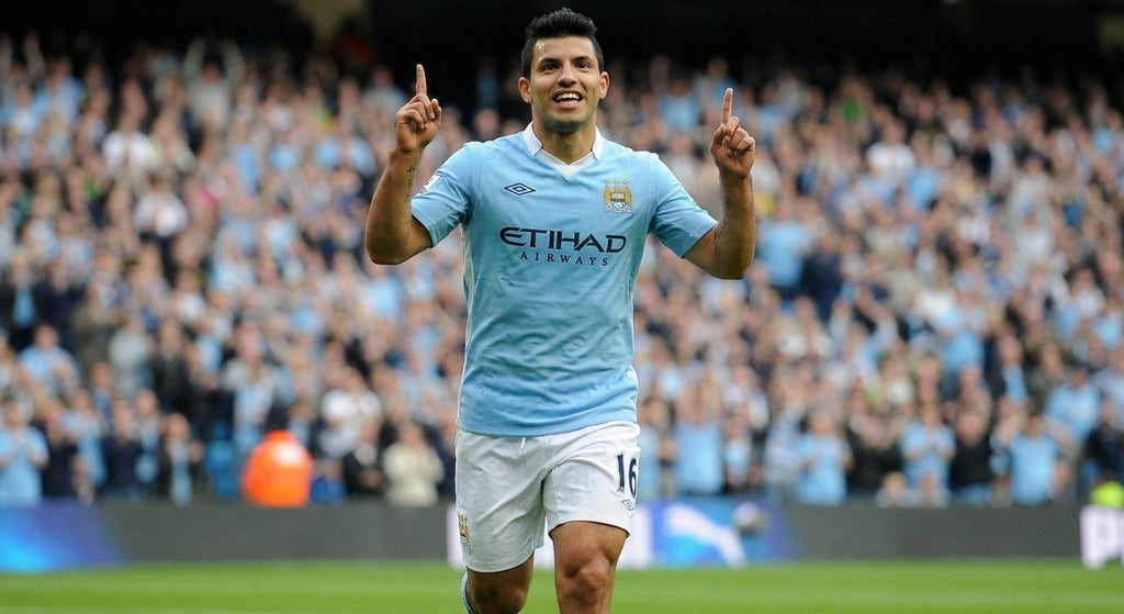 Sergio Aguero celebrating in the Manchester City 2011/12 home shirt