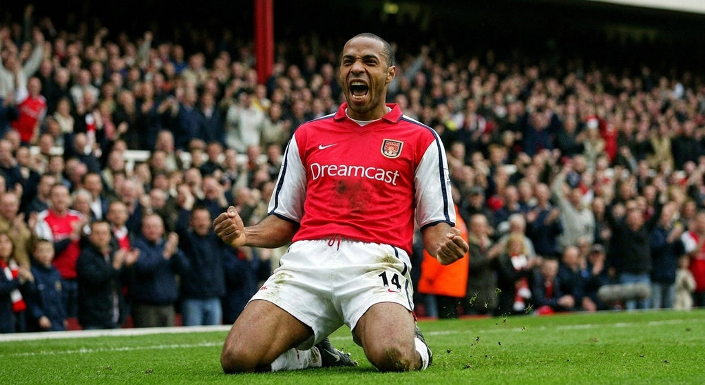 Thierry Henry celebrating in the Arsenal 2001/02 home shirt