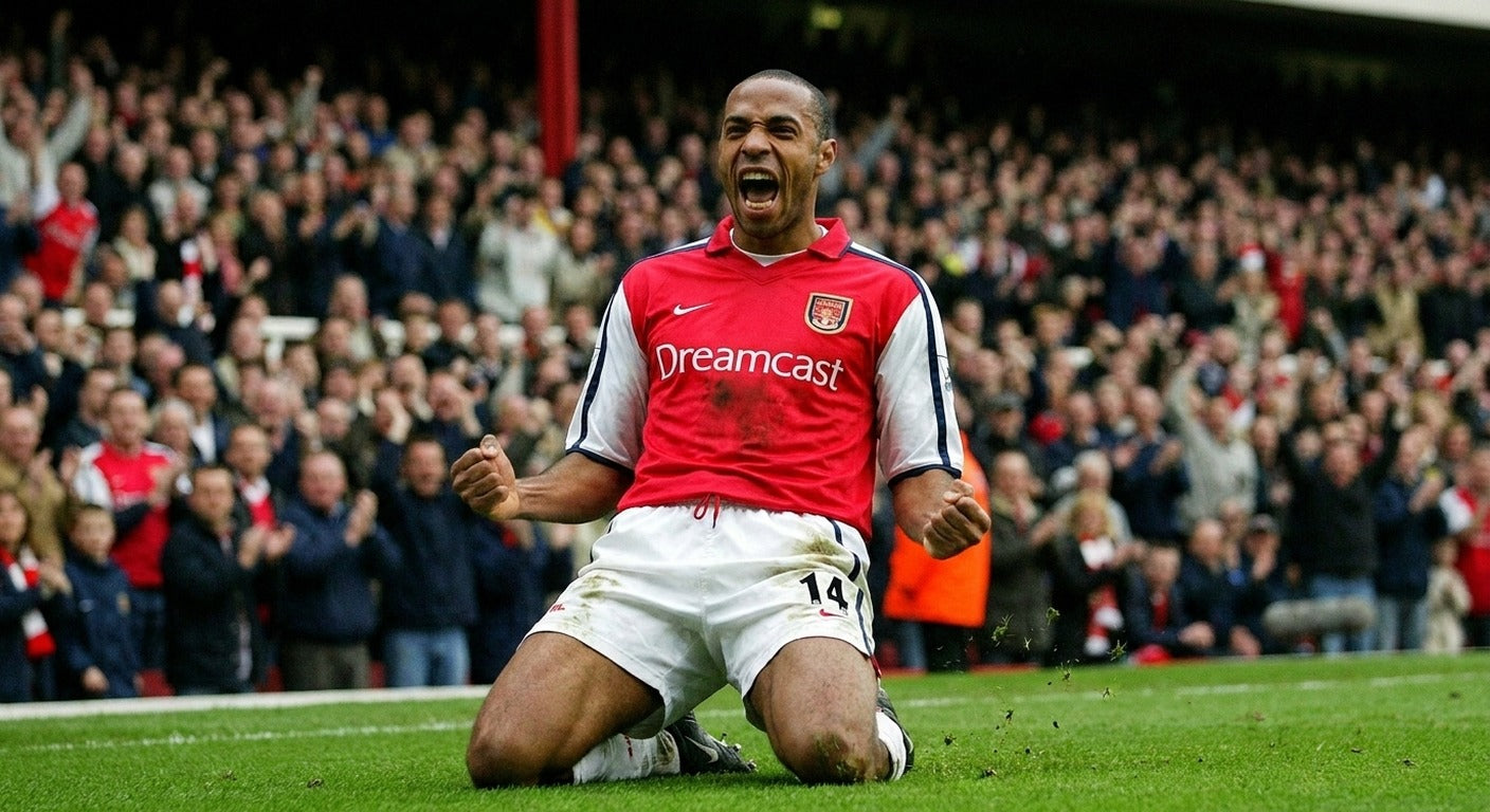Thierry Henry celebrating in the Arsenal 2001/02 home shirt