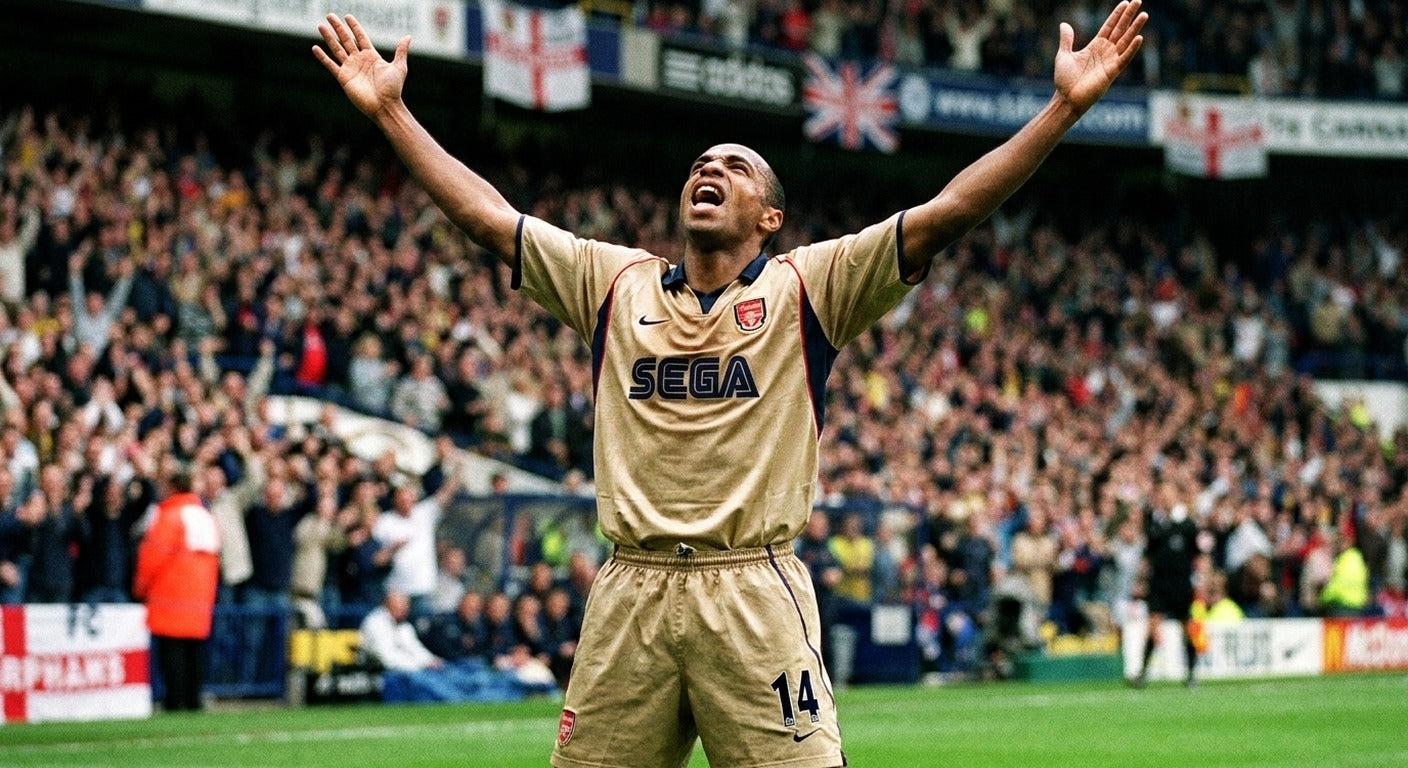 Thierry Henry celebrating in the Arsenal 2001/02 away shirt