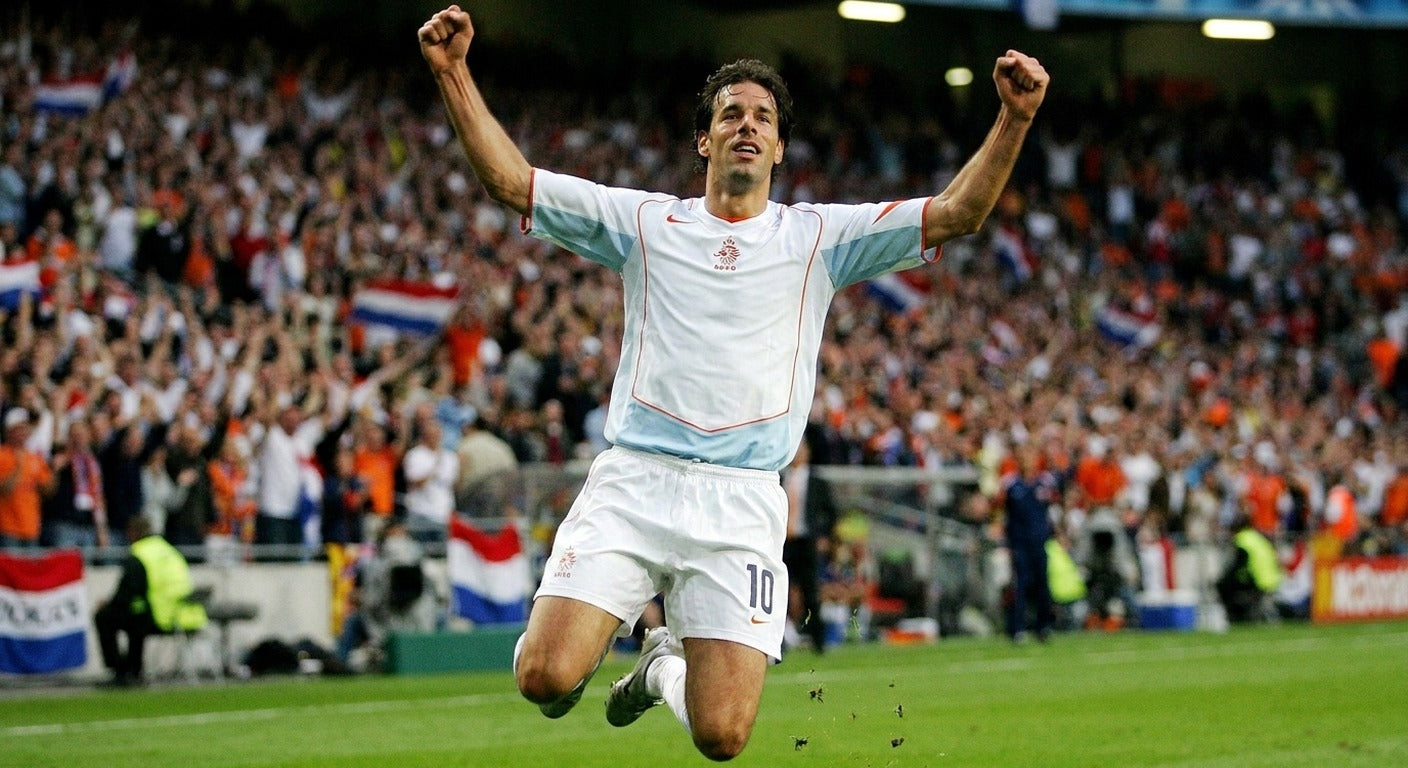 Ruud van Nistelrooy celebrating in the Netherlands 2004 away shirt