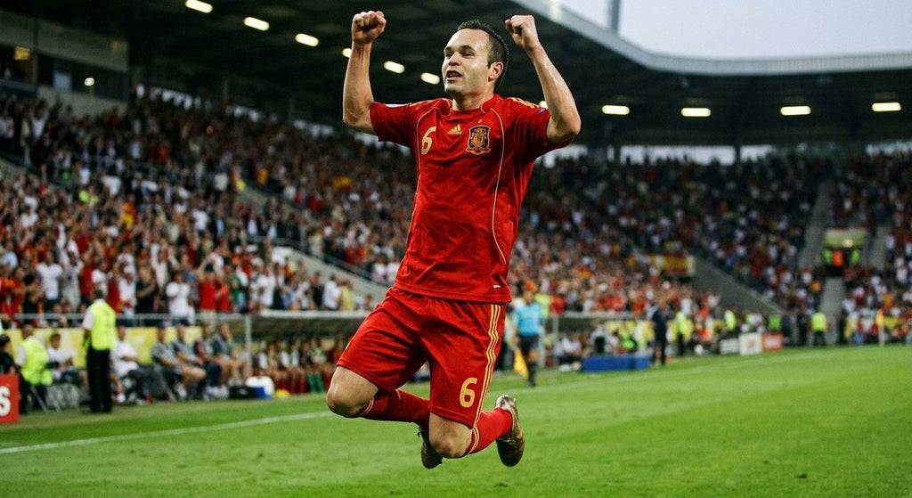 Andres Iniesta celebrating in the Spain 2008 home shirt