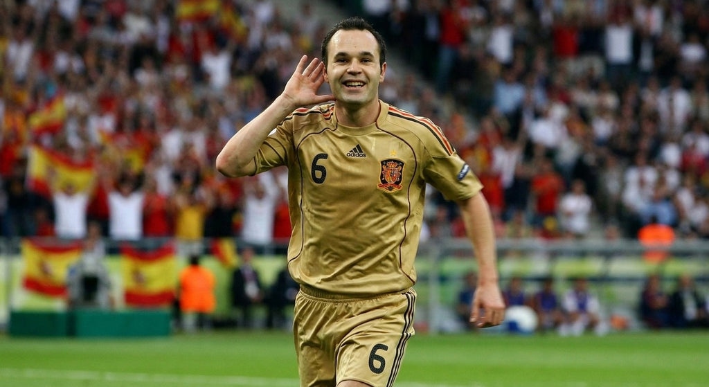 Andres Iniesta celebrating in the Spain 2008 away shirt