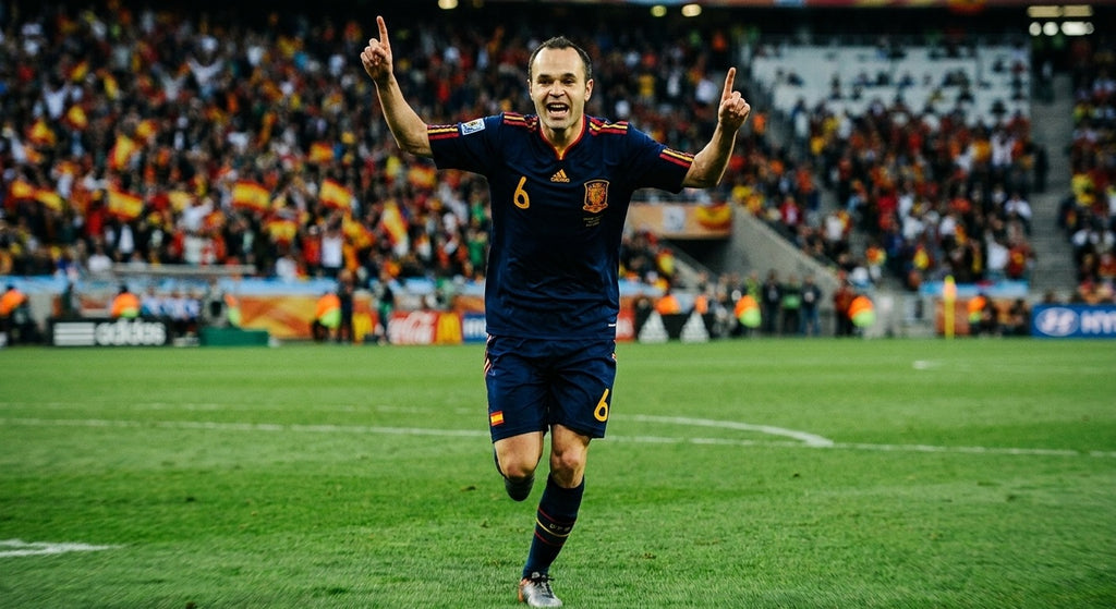 Andres Iniesta celebrating in the Spain 2010 away shirt