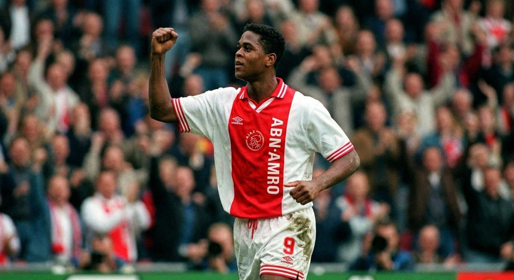 Patrick Kluivert celebrating in the Ajax 1994/95 home shirt