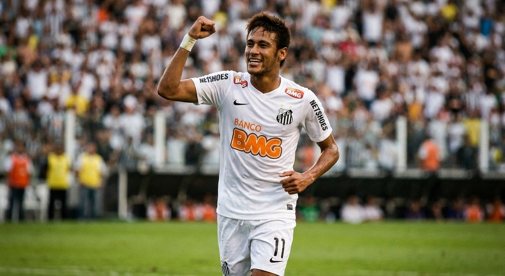 Neymar Jr celebrating in the Santos 2012/13 home shirt