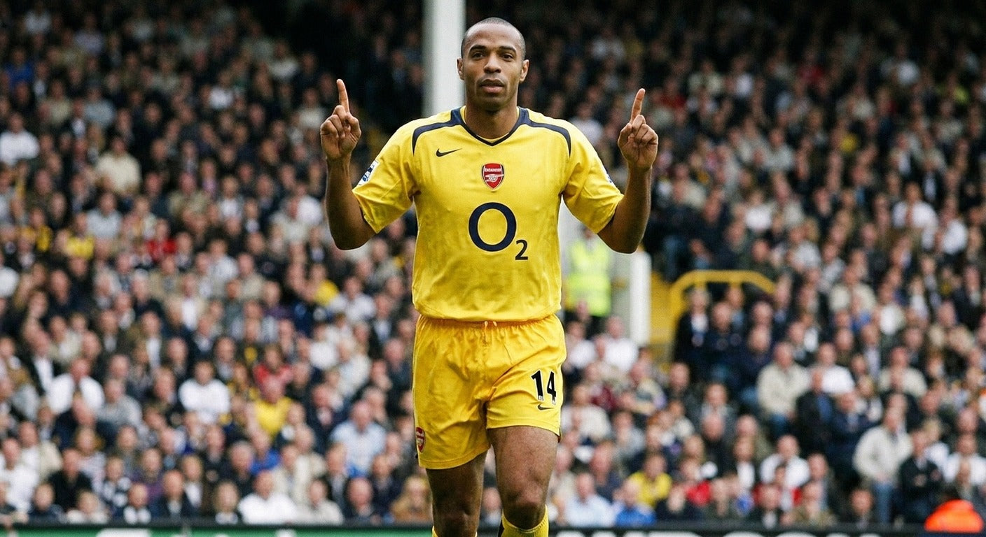 Thierry Henry celebrating in the Arsenal 2005/06 away shirt